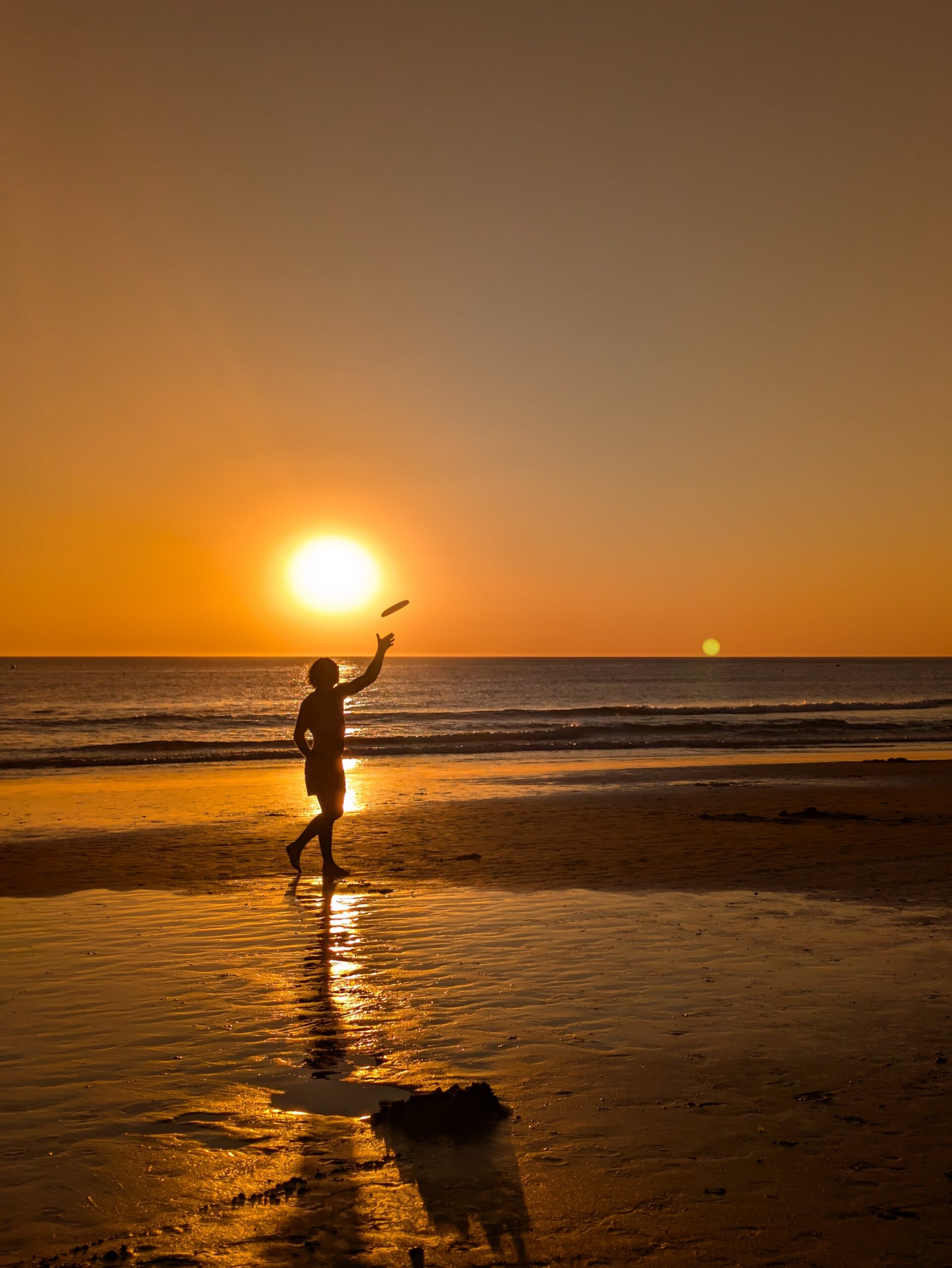 Playing Frisbee at La Barrosa Beach