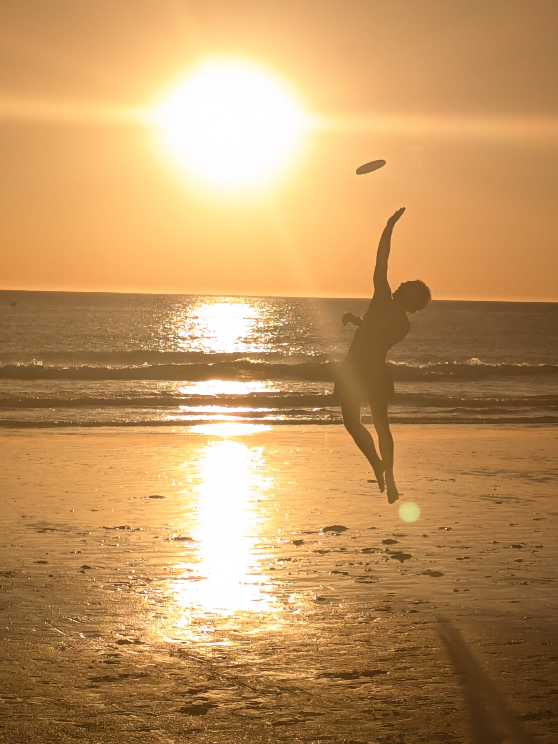 Playing Frisbee at La Barrosa Beach